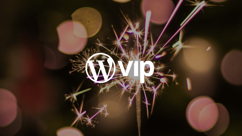 A sparkler with a lights blurred in the background and the WordPress VIP logo in the front